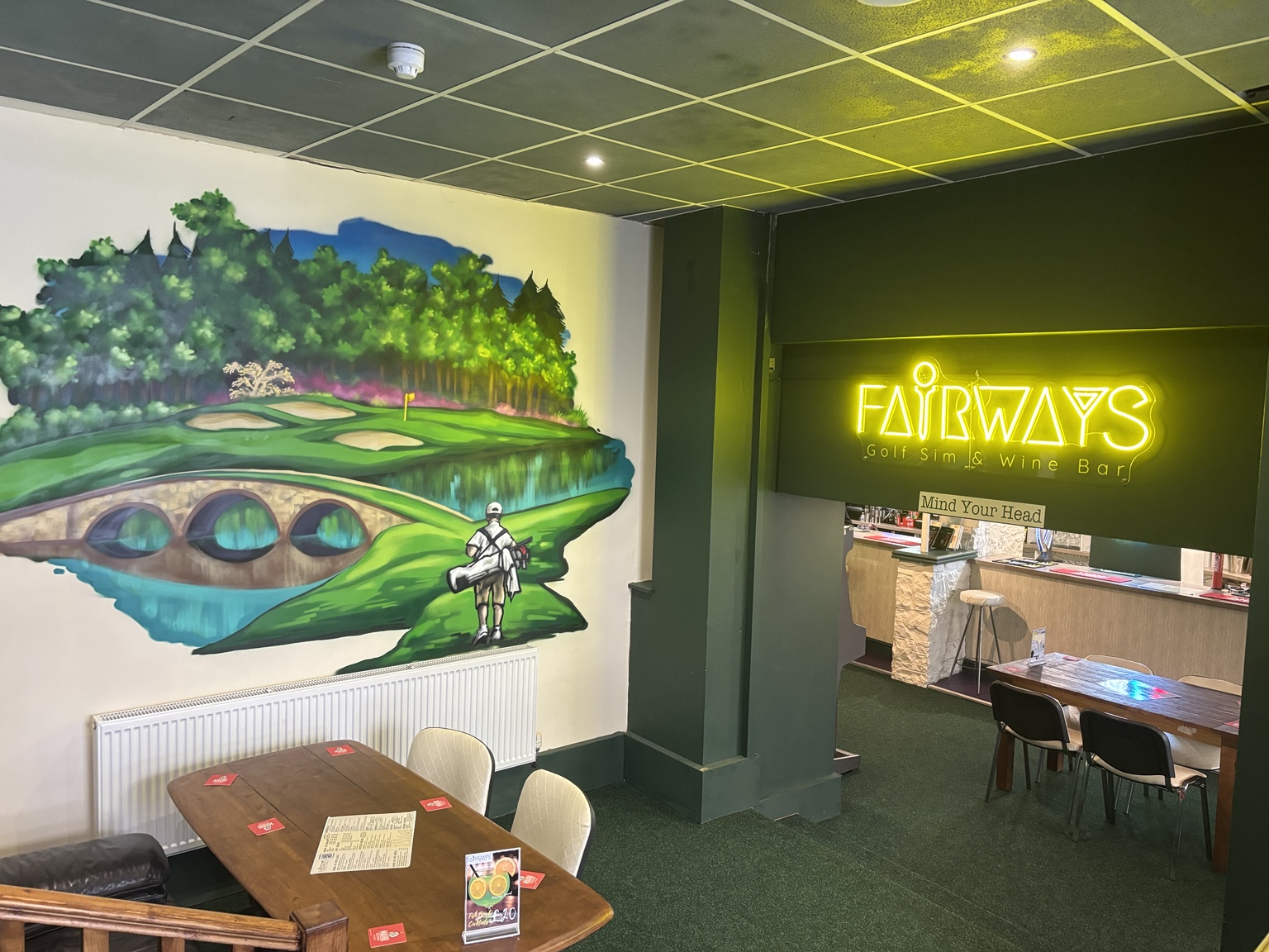 Fairways Golf Sim and Wine Bar interior with neon sign